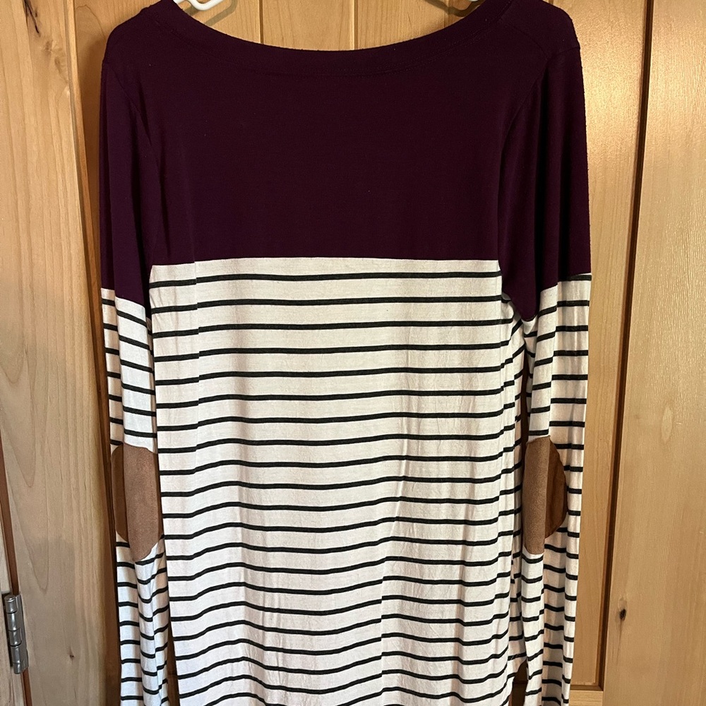 Long sleeve shirt, fun detail on elbow.